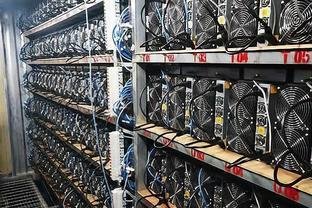A large-scale mining farm operating in a vast warehouse.