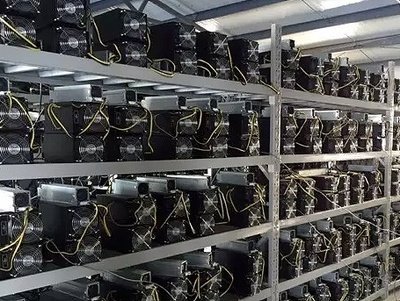 A sprawling cryptocurrency mining farm with rows of high-efficiency rigs